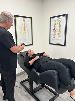 Chiropractor Conroe TX Thomas Johnson With Decompression Patient